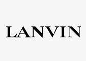 Paveikslėlyje pavaizduotas žodis LANVIN paryškintomis juodomis didžiosiomis raidėmis šviesiai pilkame fone.